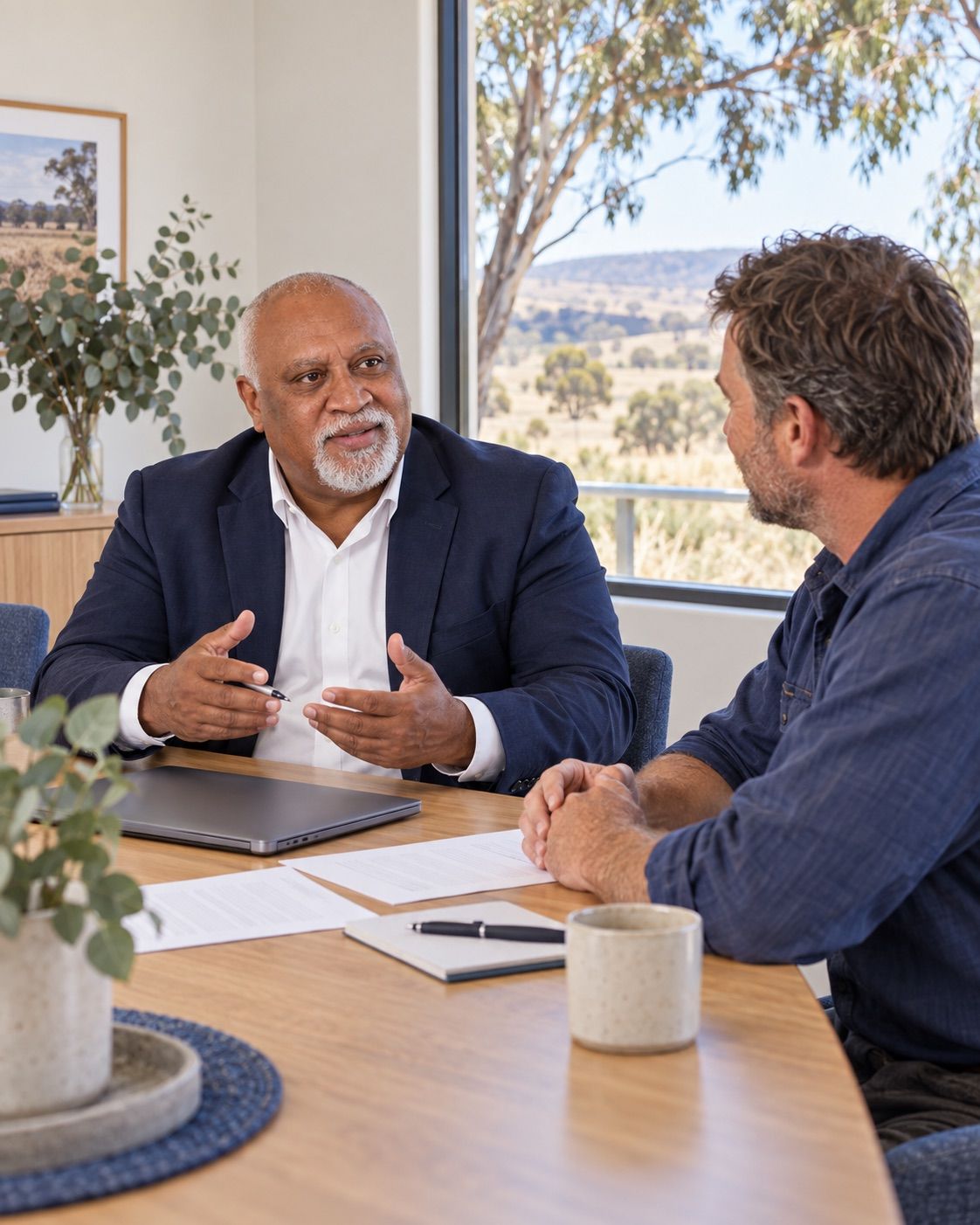 Tui Savu discussing workforce plans with a business owner